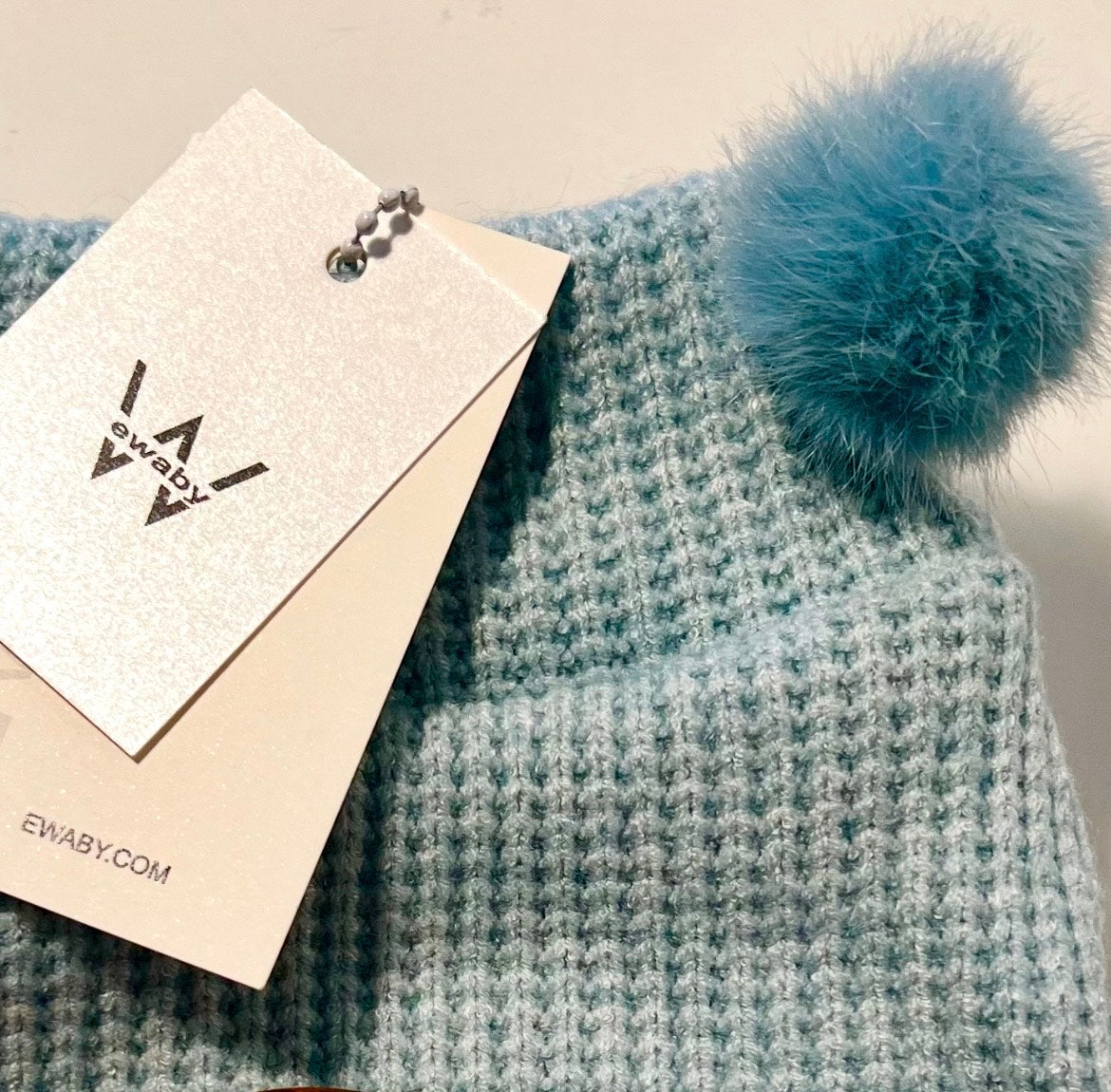 Jersey con pompón desmontable